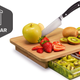 Illustration for article titled Quirky Cubo: A Tiny Cutting Board That Catches Everything